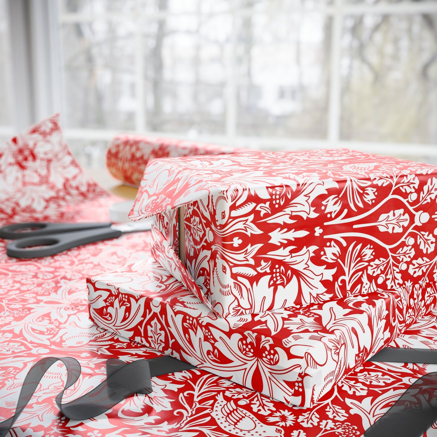 Red and white patterned fabric with scissors on a table