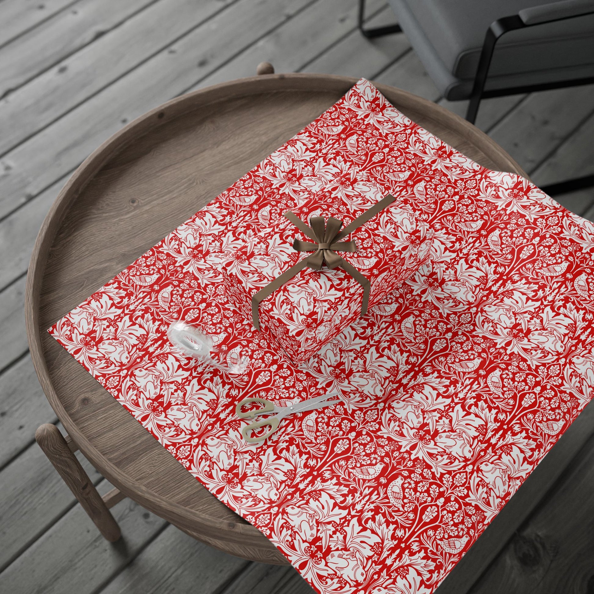 Red and white patterned paper with a spider on a wooden tray
