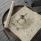 Decorative paper with bird pattern on a wooden tray