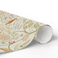 Roll of decorative paper with floral and nature-themed design on a white background