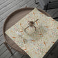 Decorative wrapping paper with floral and bird pattern on a wooden tray