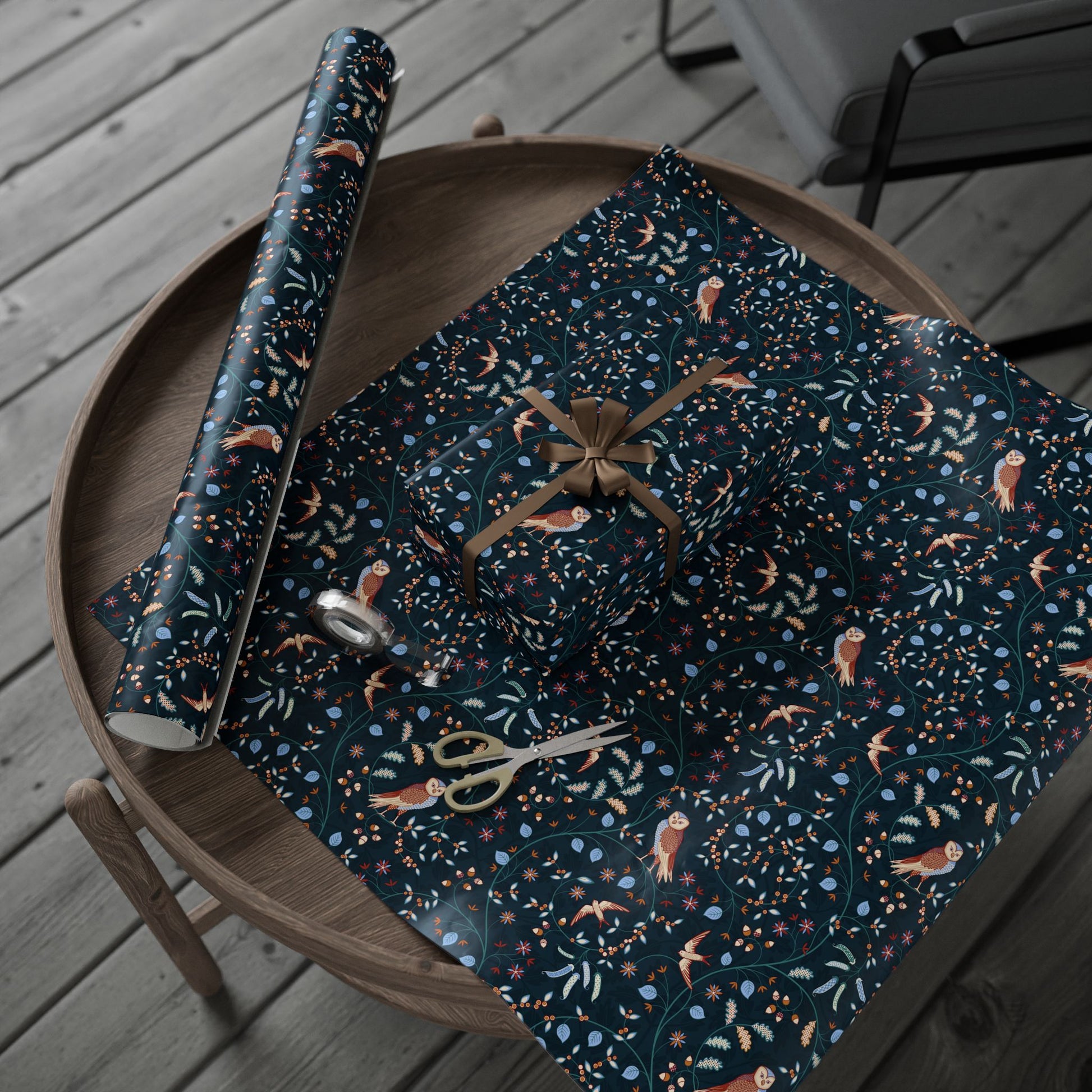 Patterned paper with scissors on a wooden tray outdoors