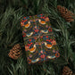 Gift wrapped in colorful paper with bird pattern on green leaves and pine cones.
