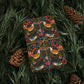 Gift wrapped in colorful paper with bird pattern on green leaves and pine cones.