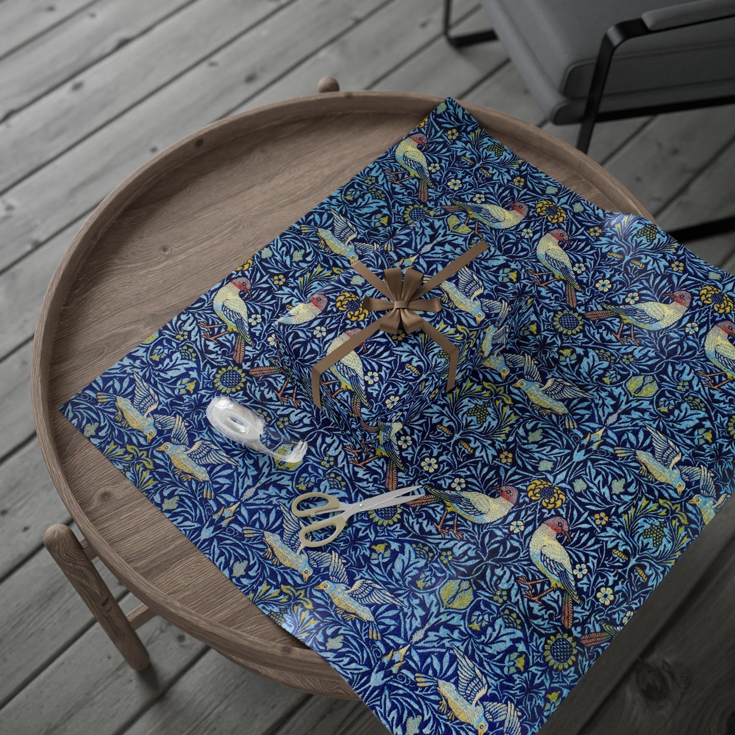 Blue patterned tablecloth with birds and flowers on a wooden tray