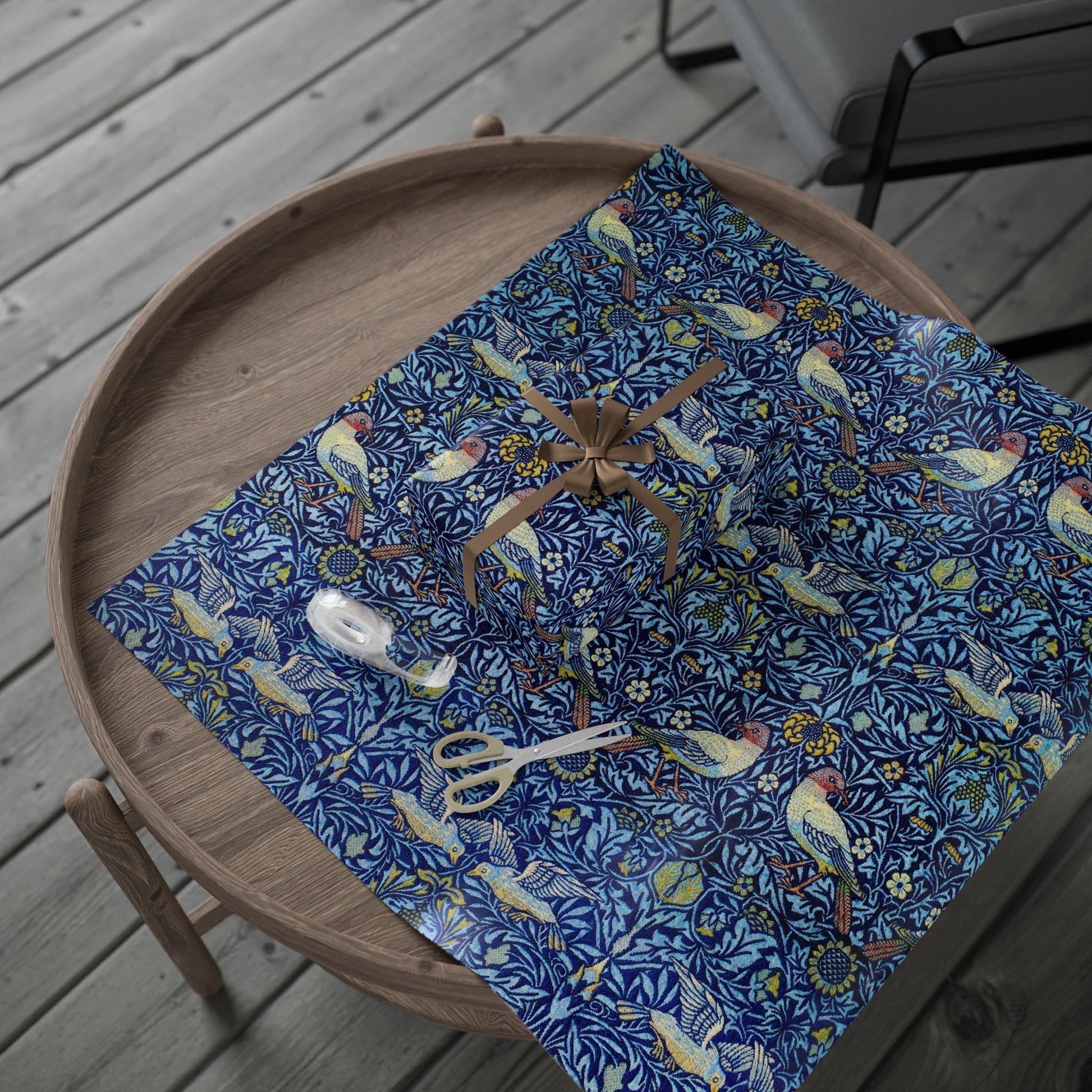 Blue patterned tablecloth with birds and flowers on a wooden tray