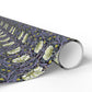 Roll of floral-patterned wrapping paper on a white background
