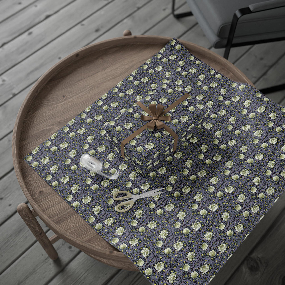 Gift box with floral pattern on a wooden tray