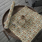 Floral-patterned paper with scissors on a wooden tray outdoors