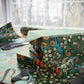 Gift wrapped in floral patterned paper with ribbons on a table.