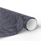 Roll of gray patterned vinyl wrap on a white background