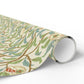 Roll of decorative paper with nature-themed design on a white background