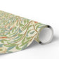 Roll of decorative paper with floral pattern on a white background
