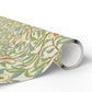Roll of decorative paper with floral pattern on a white background