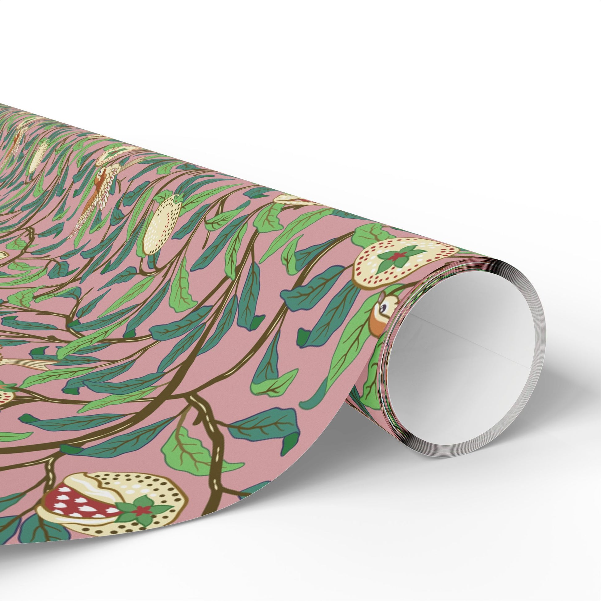Roll of pink wrapping paper with green leaf pattern on a white background