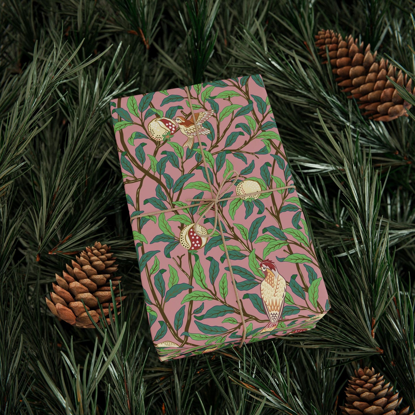 Folded fabric with floral pattern on a bed of pine needles and pine cones