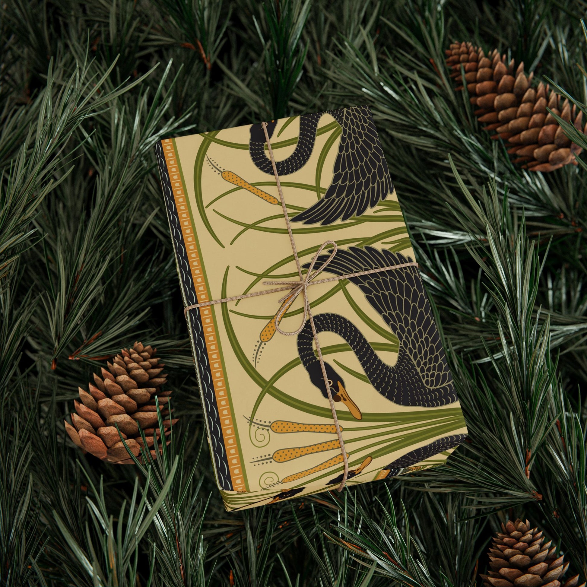 Decorative box with snake design on a green leafy background