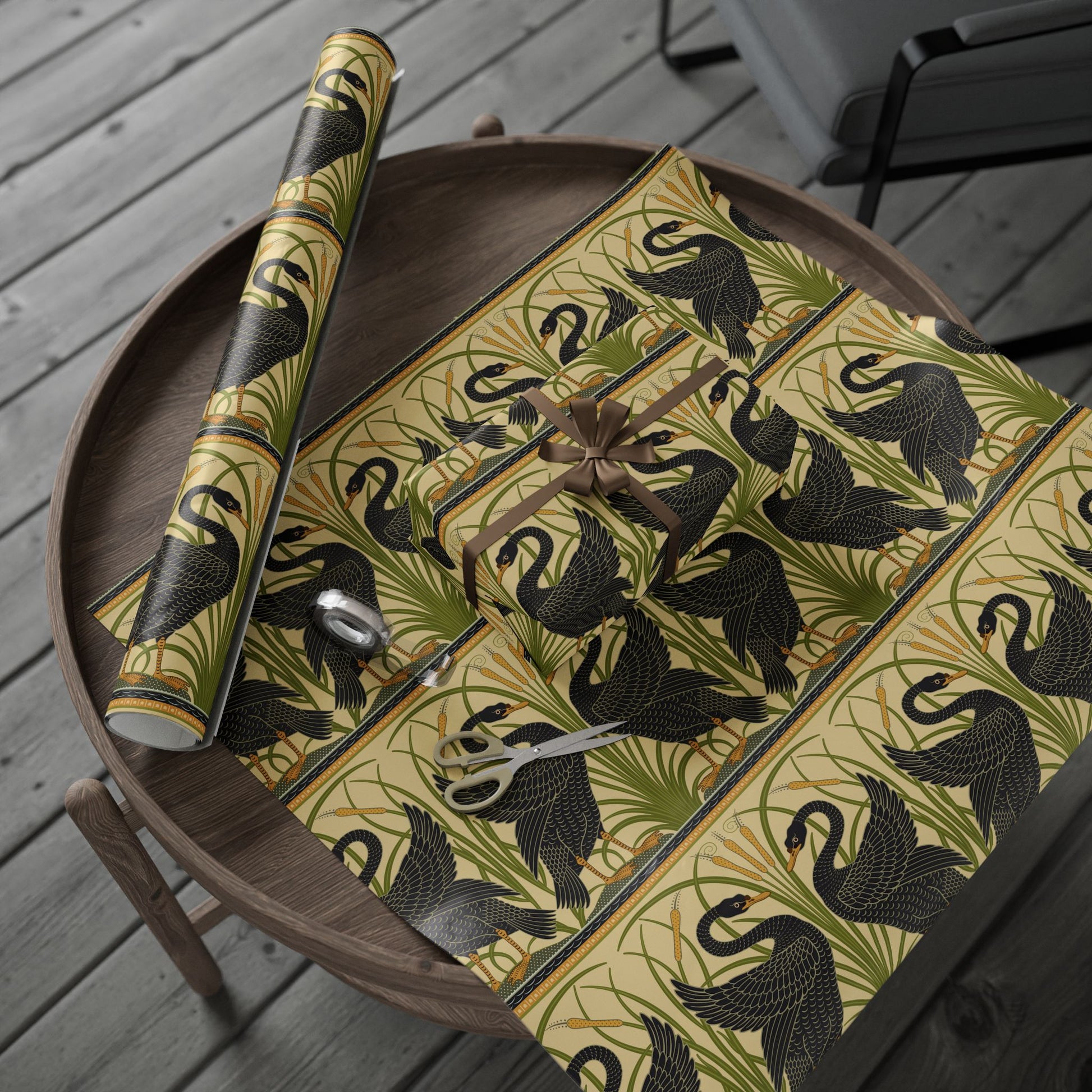 Decorative tablecloth with black swan design on a wooden tray