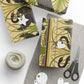 Gift-wrapped items with decorative patterns on a white surface with scissors and yarn.