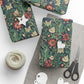 Gift wrap with floral pattern, scissors, and yarn on a white surface