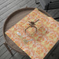 Decorative wrapping paper with floral pattern on a wooden tray