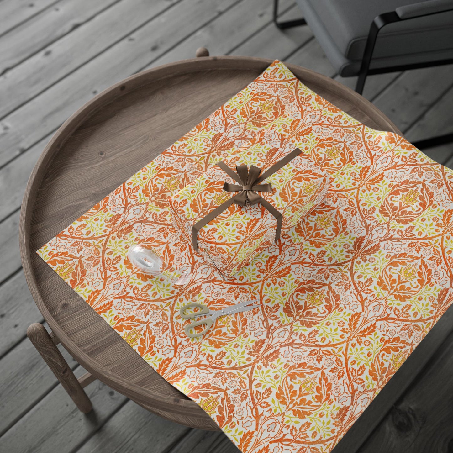 Decorative wrapping paper with floral pattern on a wooden tray