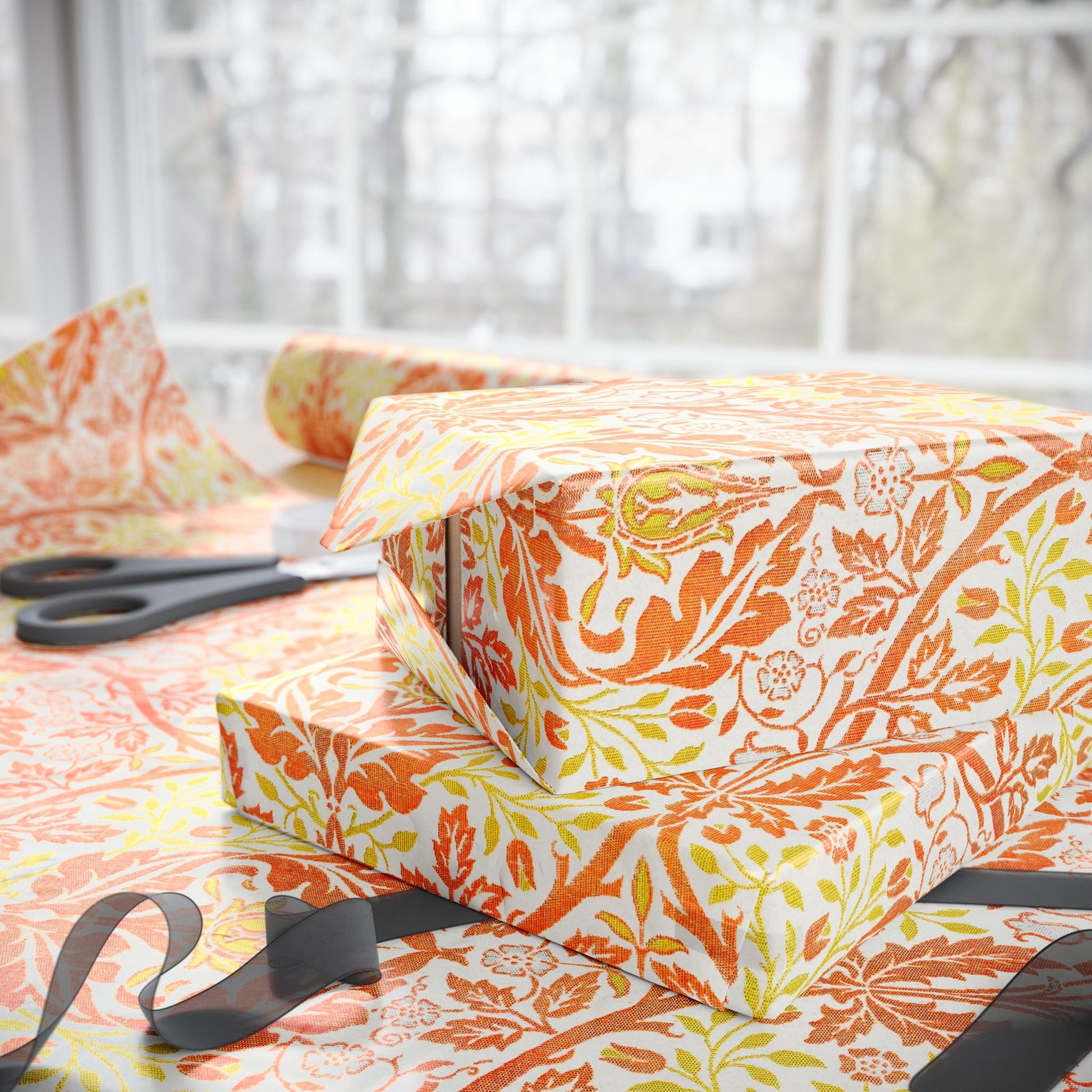 Gift boxes with floral pattern on a table with scissors
