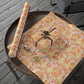Decorative paper with floral pattern on a wooden tray