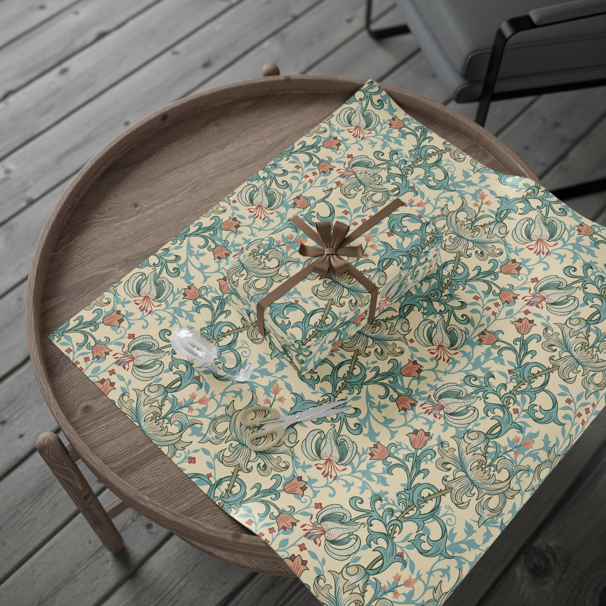Decorative wrapping paper with floral pattern on a wooden tray outdoors