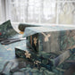 Stack of wrapped presents with floral pattern on a table