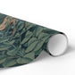 Roll of green leaf-patterned paper on a white background