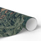Roll of green floral patterned paper on a white background