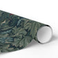 Roll of decorative paper with a leaf pattern on a white background