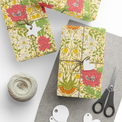 Gift boxes with floral patterns, scissors, and yarn on a white surface