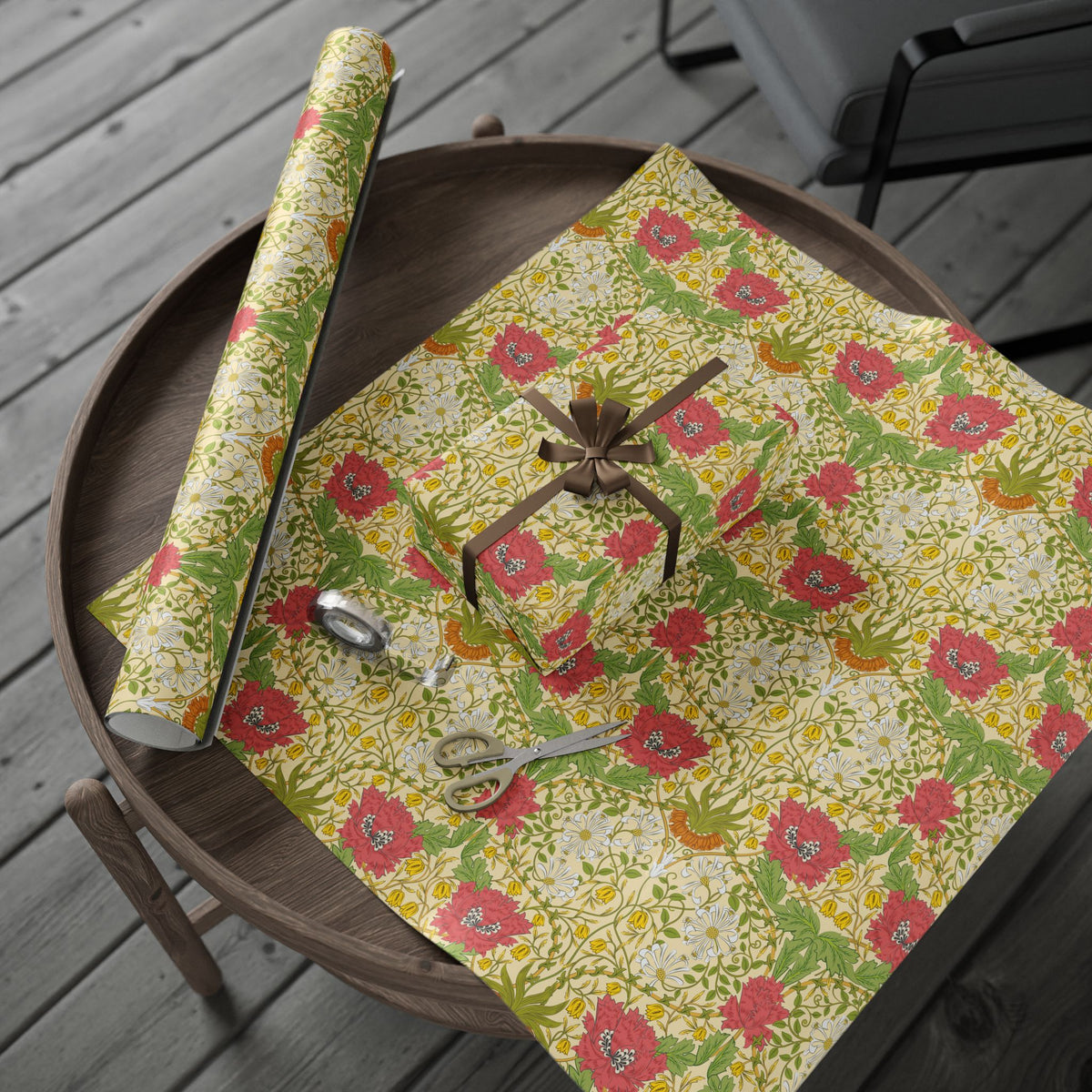Floral-patterned wrapping paper with decorative items on a wooden table