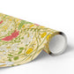 Roll of floral-patterned paper on a white background