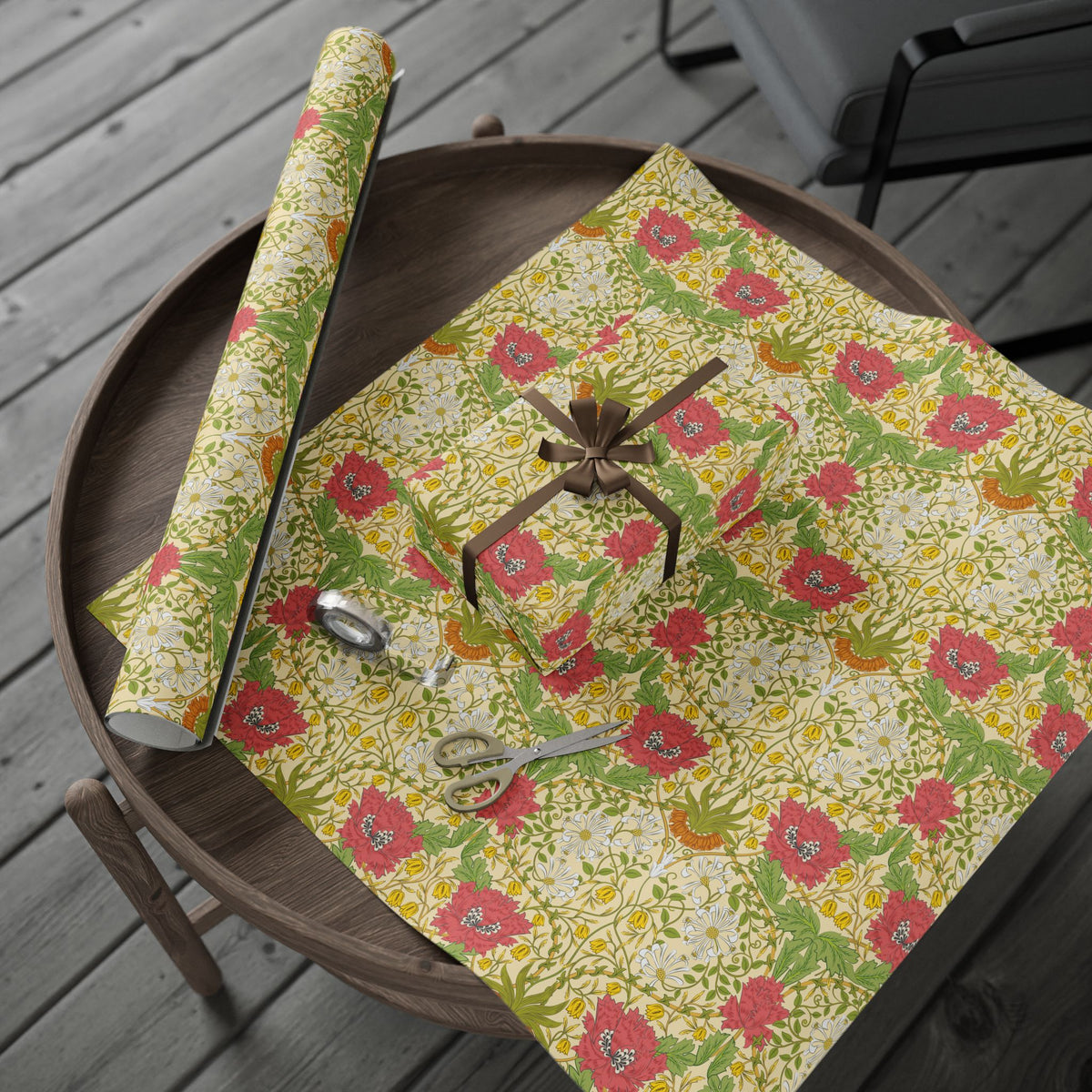 Floral-patterned wrapping paper with decorative elements on a wooden surface
