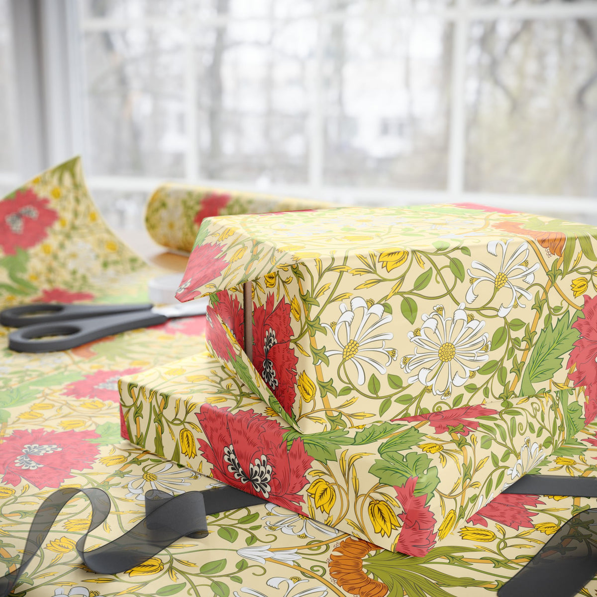 Floral-patterned wrapping paper with scissors on a matching fabric background