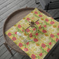 Floral-patterned wrapping paper on a wooden tray with a spider decoration.