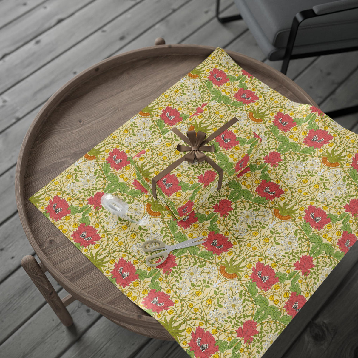 Floral-patterned wrapping paper on a wooden tray with a spider decoration.