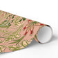 Roll of decorative paper with a floral pattern on a white background