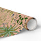 Roll of floral-patterned paper with green leaves and pink background on a white background