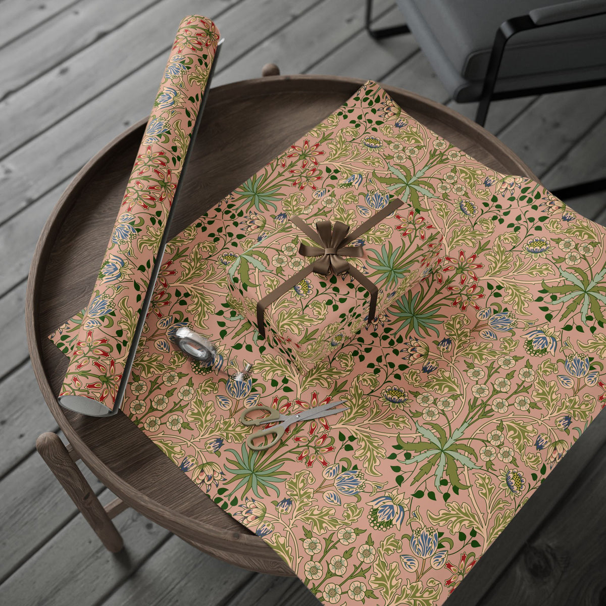 Floral-patterned table mat with decorative elements on a wooden surface