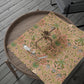 Decorative table runner with floral pattern on a wooden table