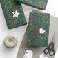 Decorative green packages with paper tags and scissors on a white surface