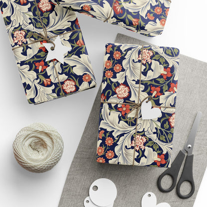 Floral-patterned packages with string, scissors, and yarn on a white surface