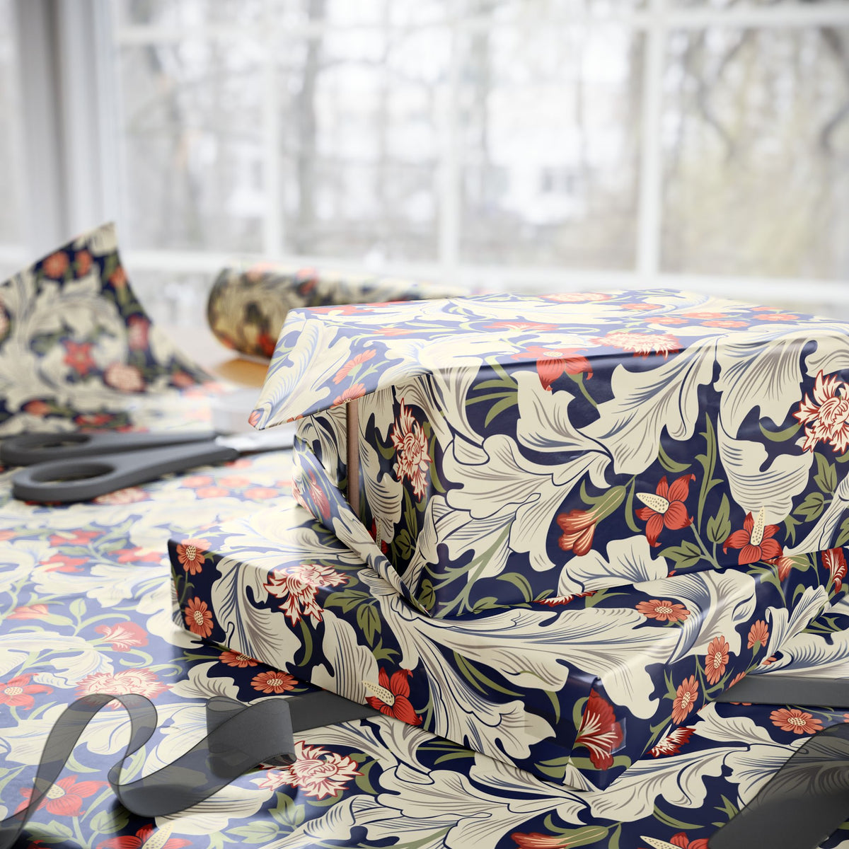 Floral-patterned fabric on a bed with scissors in the background