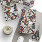 Floral-patterned packages with string, scissors, and yarn on a white surface