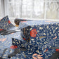 Stack of wrapped presents with floral pattern on a table