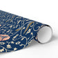 Roll of decorative paper with floral and bird pattern on a blue background